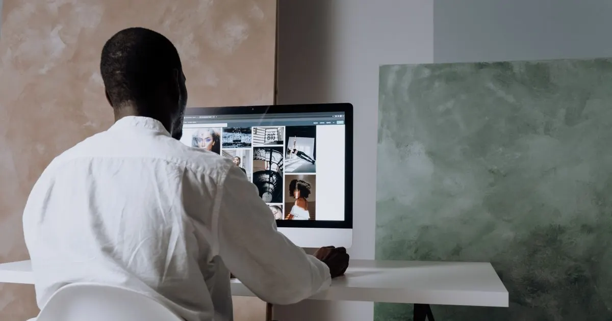 A professional working online at a desktop computer