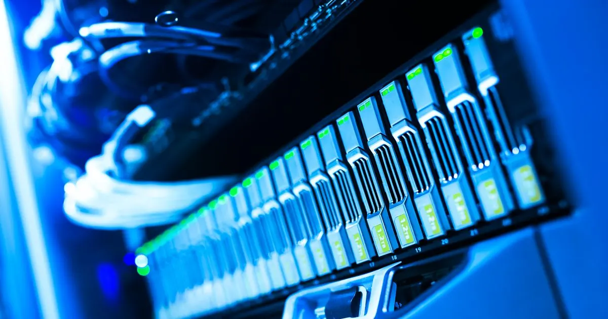 Server storage drives lit in blue in a data centre