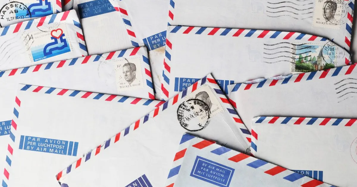 A flat-lay of air-mail envelopes