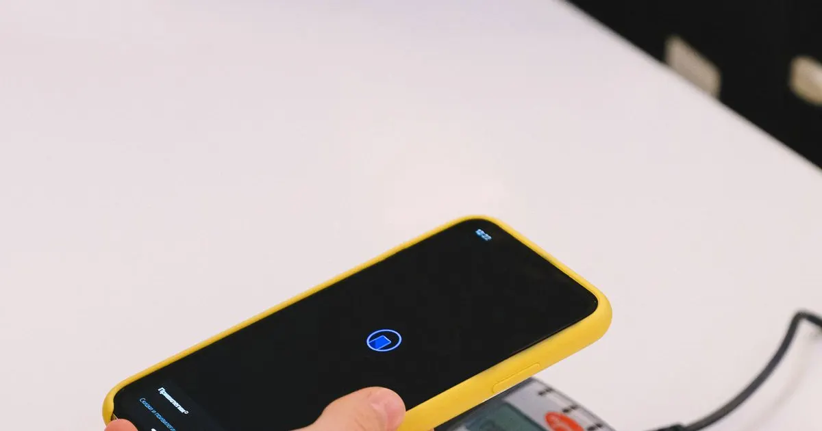 A phone tapped on a card payment terminal