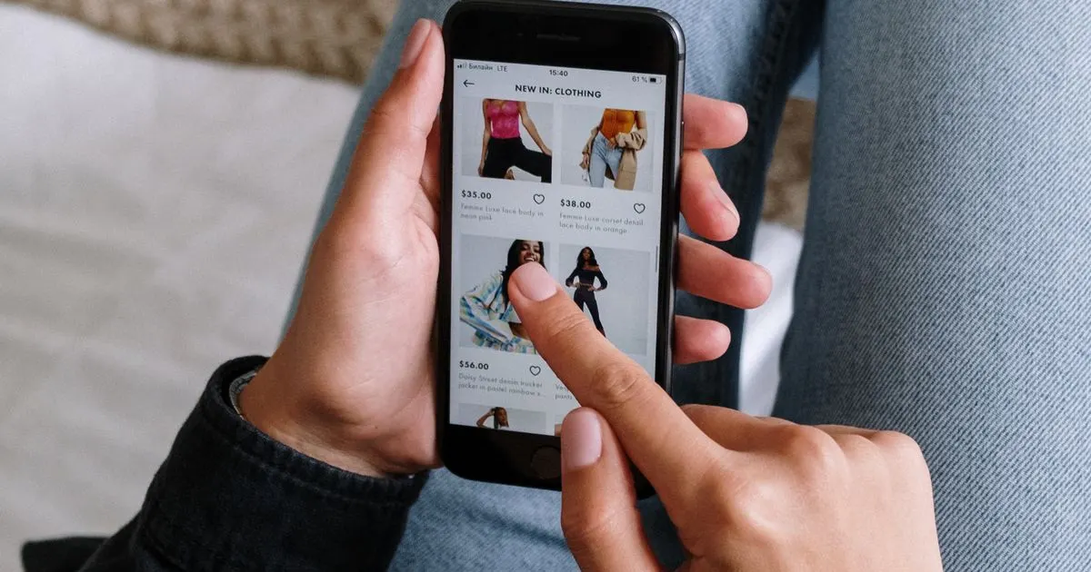 A customer browsing an online clothing store on a smartphone