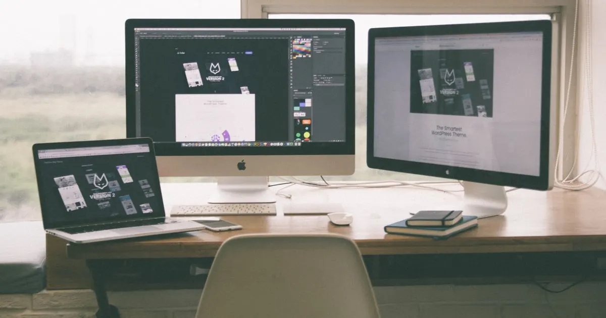 A website design shown across desktop and laptop screens